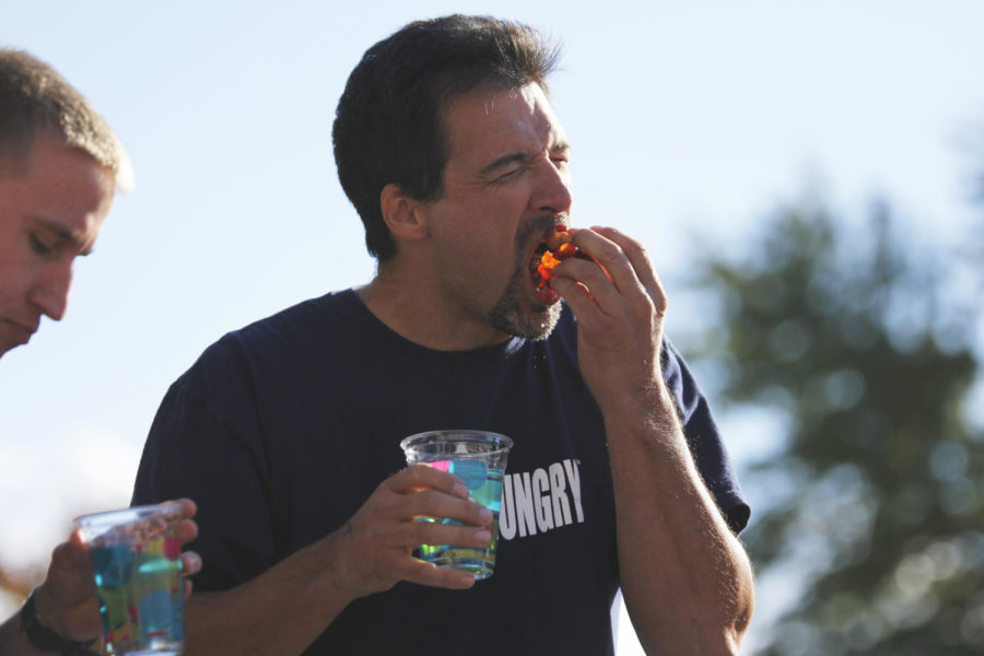 Mark Williams competes in the bacon-eating contest at the Bacon Expo on Saturday, Oct. 19. Williams won the male event and has competed in 18 food eating competitions.