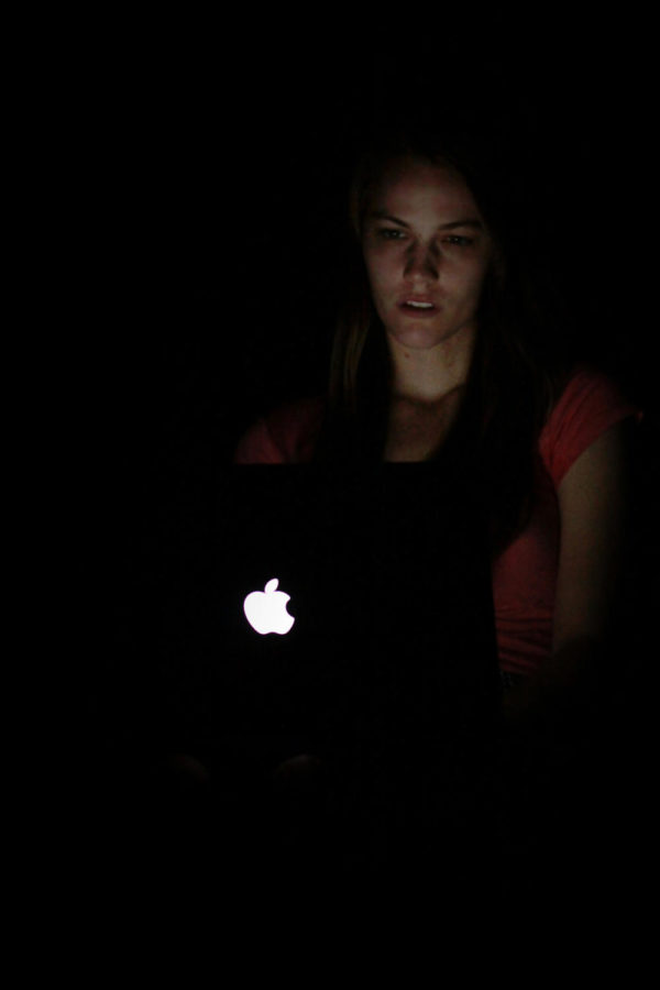 Kelley Werner, a sophomore in journalism and mass communication, studies outside Hamilton Hall late at night to keep up with studies.