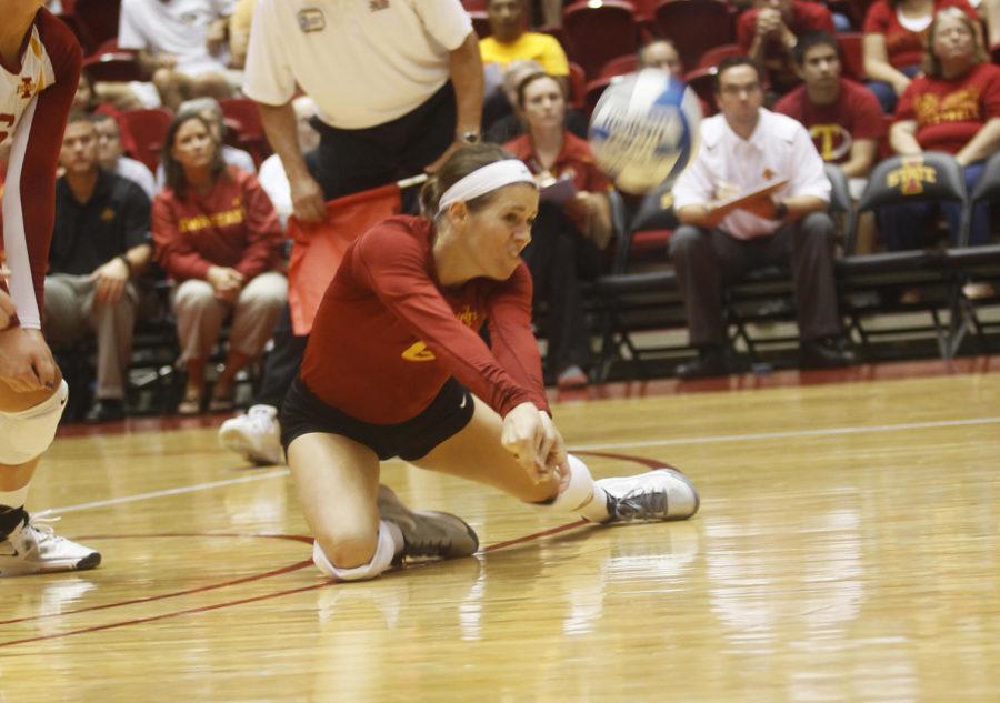 Kristen Hahn, libero for the ISU volleyball team, dives to dig a hit by Illinois. Hahn had a total of 13 digs at the end of the set.