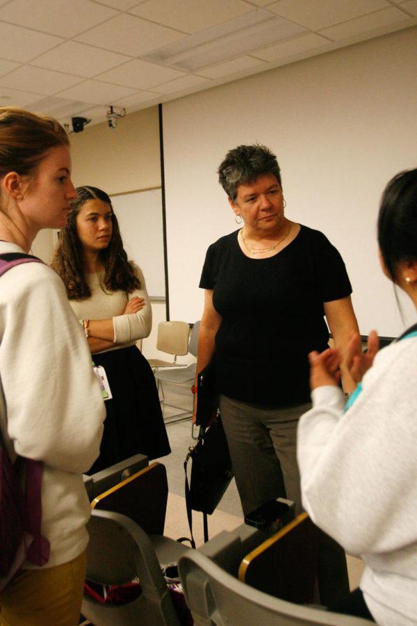 Anne Kinzel listens to suggestions by Monica Diaz, sophmore in civil engineering, while her friends Abbie Romano, second from left, sophmore in global resource systems and Jane Kerson, far left, sophmore in political science listen nearby. Ames City Council members meet with students on Wednesday, Oct. 9, in Pearson Hall.