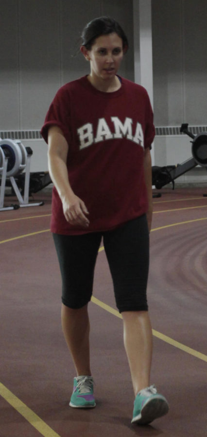 Kate Holland, junior in kinesiology and health, walks the track at the Lied Recreation Athletic Center to stay in shape.