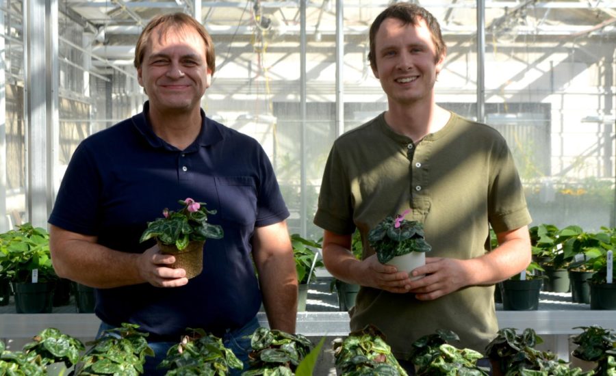 James+Schrader+and+Kenneth+McCabe%2C+researchers+for+the+5-year+program+in+development+of+bioplastics%2C+hold+samples+of+bioplastic+pots+being+tested+at+Horticulture+Hall.
