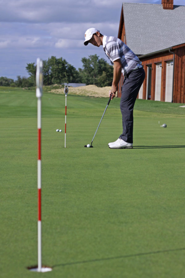 Senior Scott Fernandez  practices putting at the ISU golf performance center on U.S Highway 69 just south of Ames on Sept. 21, 2013.