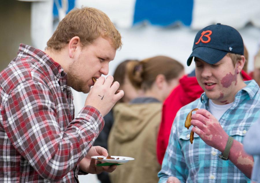 The people test different kinds of bacon during Bacon Expo 2013.