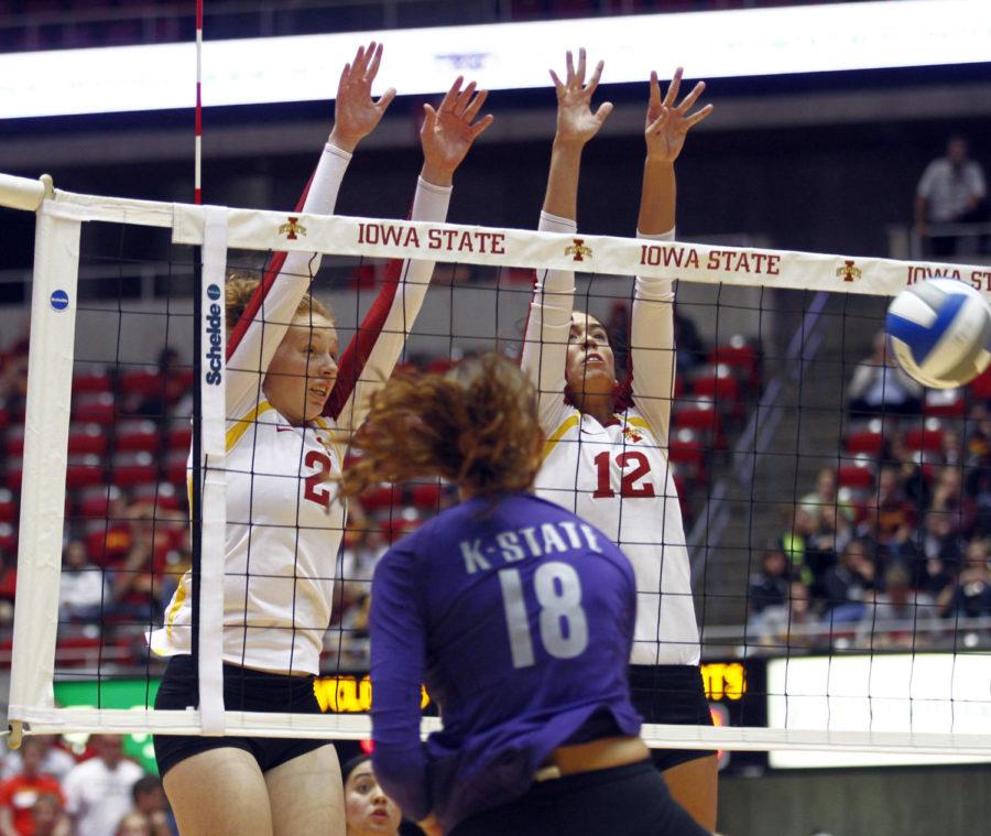 Iowa States No. 2 Mackenzie BigbeeCQ and No. 12 Tory KnuthCQ block Kansas States Courtney TraxsonCQs attempt of sending the ball over the net Wednesday, Oct. 9, at Hilton Coliseum. The Cyclones swept the Wildcats 3-0.