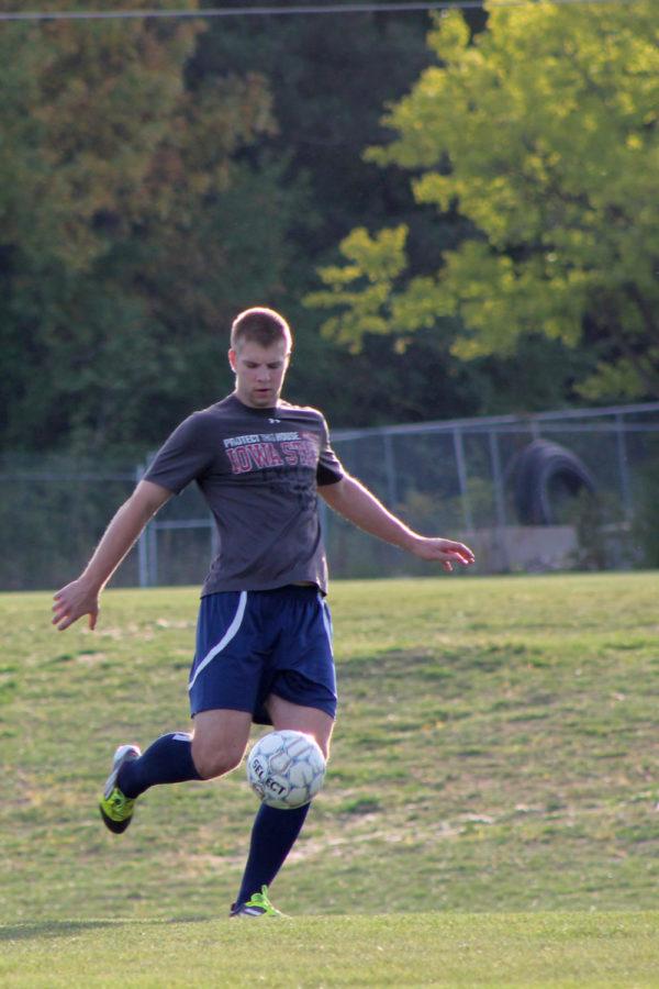 Striker Simon Goettl kicks the ball at the ISU mens soccer club practice in September. The club will compete in the open championship bracket at nationals in Phoenix, AZ. Goettl is currently nursing an ankle injury but should return for nationals.