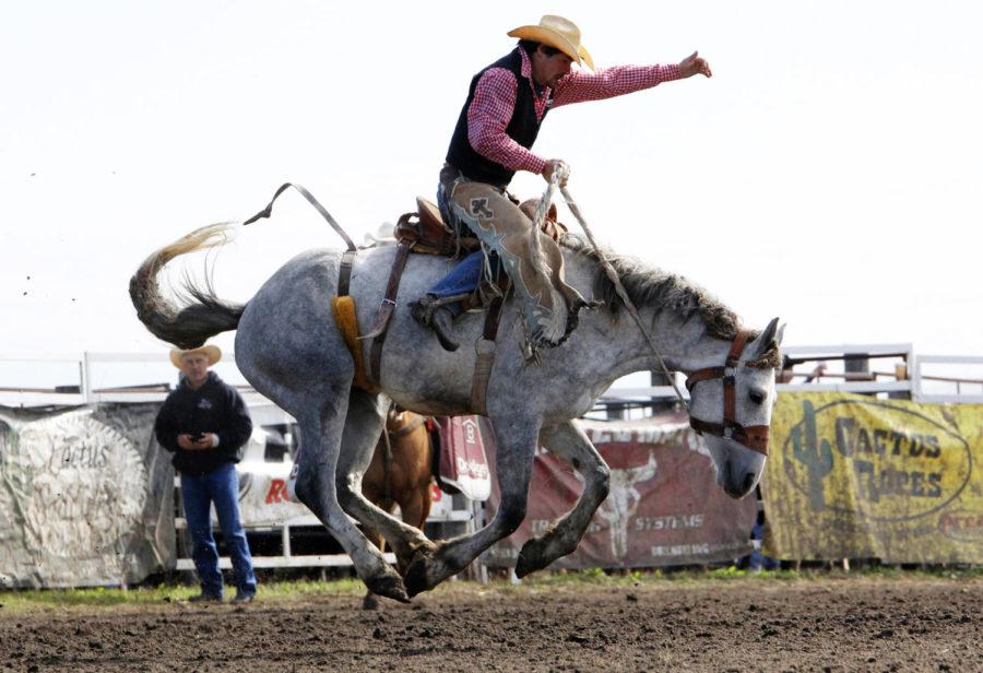 Kyle Hapney, of the Mitchell Technical Institute, competes in the saddle bronc on Oct. 5 at the Cyclone Stampede Rodeo.