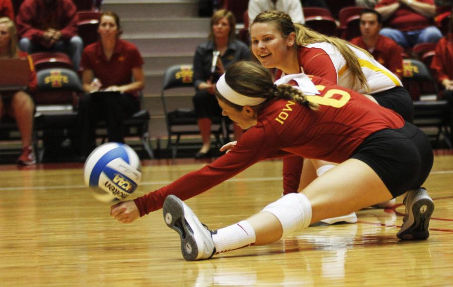 Senior Kristen Hahn and sophomore Caitlin Nolan both attempt to dig the ball against Baylor on Sept. 28 at Hilton Coliseum. The Cyclones won in straight sets 25-14, 25-19, 25-17.