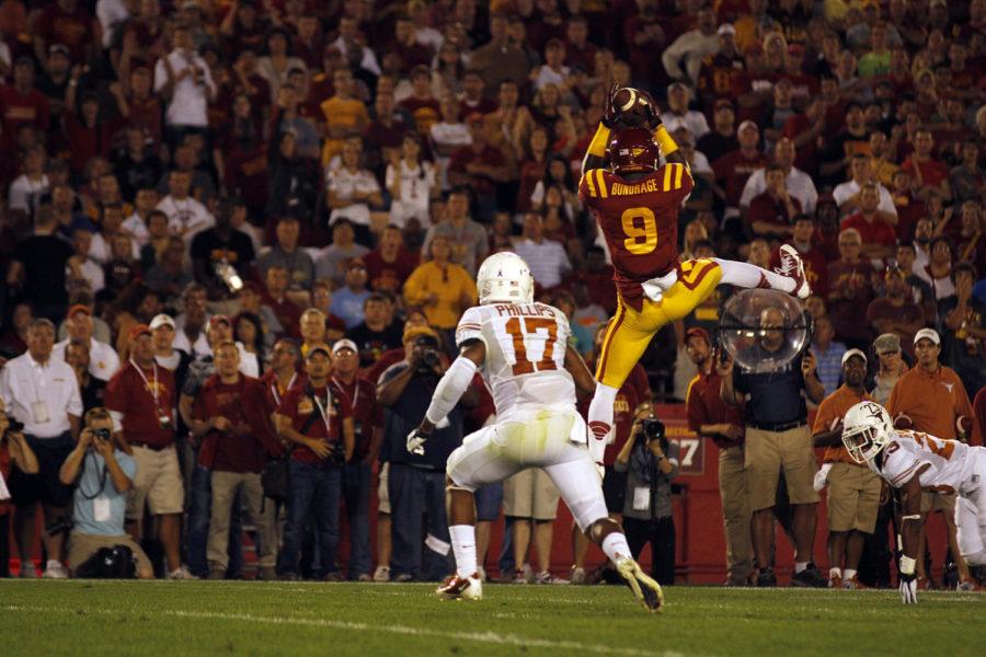 ISU redshirt sophomore receiver Quenton Bundrage makes a leaping catch in between two Texas defenders during the Cyclones 31-30 loss to the Longhorns on Oct. 3 at Jack Trice Stadium.