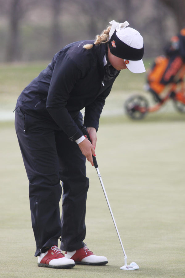 Cajsa+Persson%2C+a+freshman+in+Pre-Business%2C+lines+up+her+putt+at+the+Big+12+Golf+Tournament+on+Sunday%2C+April+21+at+The+Harvester.