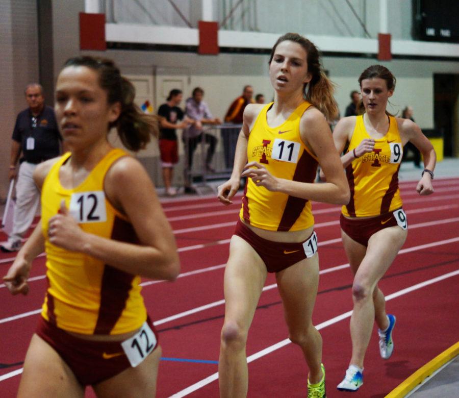 Samantha Bluske (left), Crystal Nelson, (middle), and Katy Moen (right) run the womens 5,000-meter run on Feb. 9 in Lied Recreation at the Iowa State Classic. The three runners finished 10-12th place in the race.
