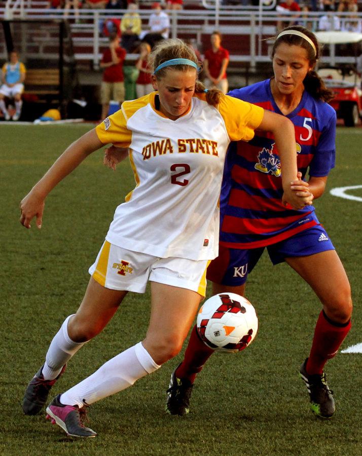 No. 2 freshman forward Koree Willer fights off a Kansas player for possession during Iowa States 0-0 double overtime tie with the Jayhawks on Oct. 4 at the Cyclone Sports Complex.