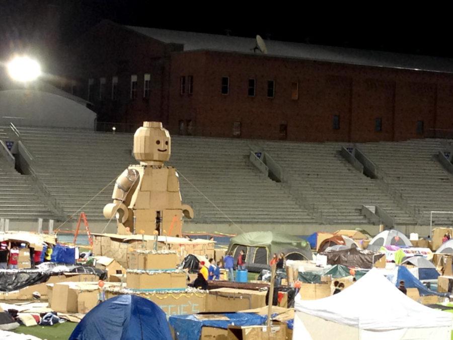 Lego Man towers over the participants of Reggies Sleepout on Saturday, Nov. 16, at Drake Stadium. The group was made up of Johnston High School alum and current students, as well as current students of Iowa State.