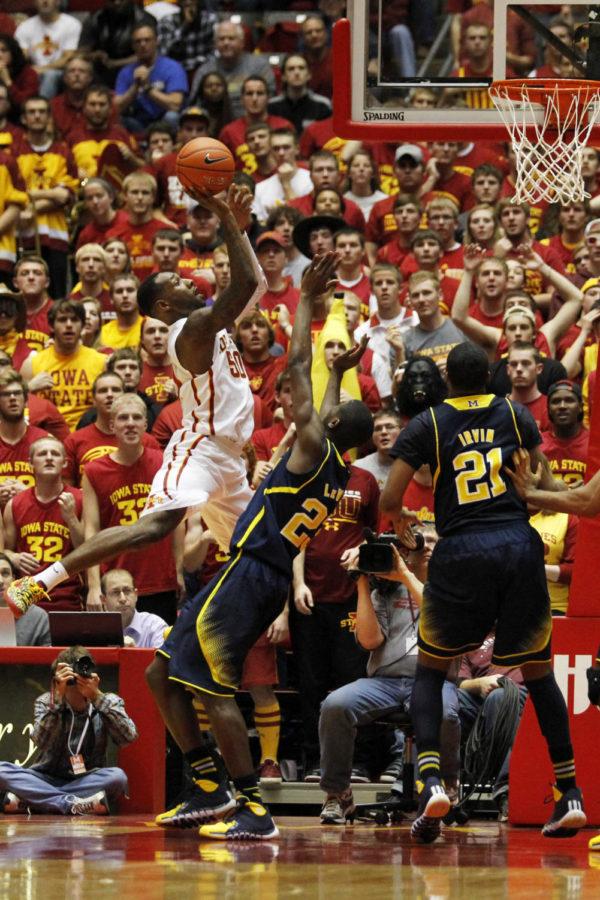 Senior guard DeAndre Kane goes up for the shot against Michigan at Hilton Coliseum on Nov. 17. At half the Cyclones lead 35-34 with Kane scoring six points thus far.