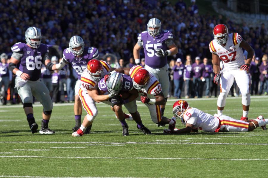 Iowa States Jeremiah George and Cory Morrissey tag-team a tackle on K-State running back John Hubert. The Wildcats pulled off a victory against the Cyclones with a score of 41-7.