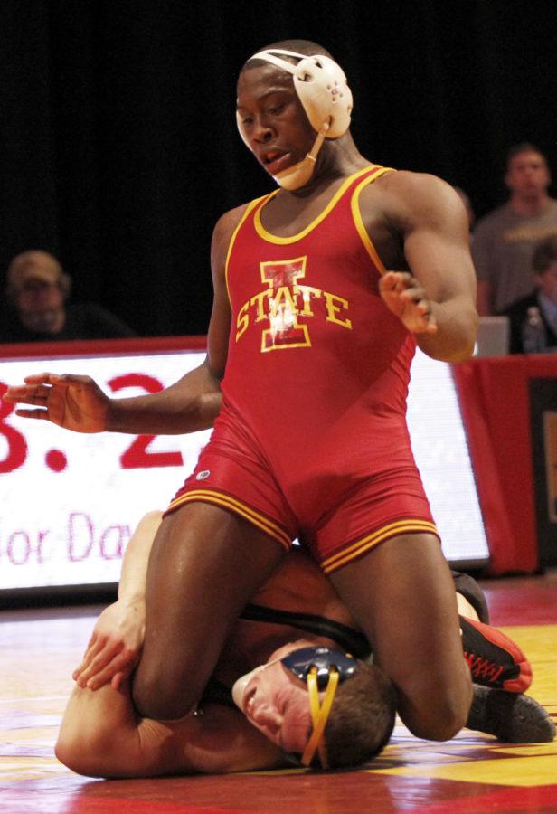 After pushing him to the floor, redshirt junior Kyven Gadson lands on top of Drexels Brandon Palik in their 197-pound match on Nov. 7 at Hilton Coliseum. Gadson won the close matchup 7-6, helping the Cyclones close out with momentum in their 24-16 victory.