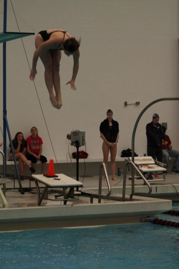 Sophomore+Elyse+Brouillette+performs+a+dive+in+the+second+round+of+three-meter+platform+attempts.+Her+dive+garnered+a+significant+amount+of+points+to+give+a+substantial+lead%2C+finishing+roughly+fifty+points+ahead+of+2nd+place+TCU+diver+Kristen+Connolly.+Brouillette+additionally+set+a+new+season+record+with+329.48+that+night%2C+only+nine-points+shy+of+an+all-time+school+record+performance.