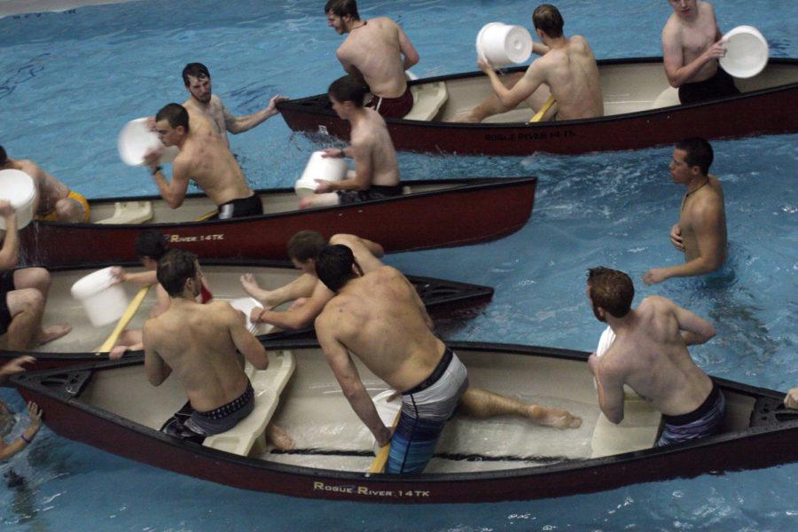Students participate in the intramural Battleship H2O at State Gym on Nov. 12. In the event, teams of three try to sink their opponents battleship (canoe) by throwing buckets of water into their boat. The last team floating wins.