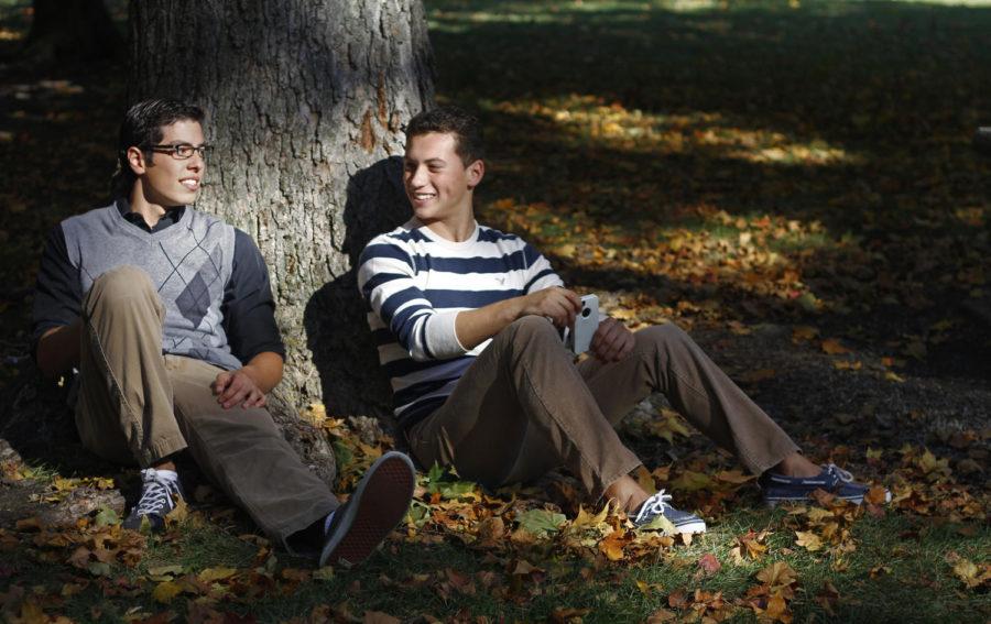 Two outfit-approved gentlemen relax on campus in what many girls say they wouldnt mind seeing on their first date.