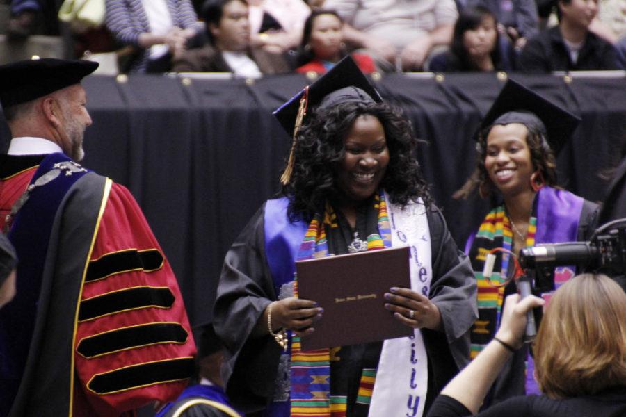 Graduate Ebony Jones receives her degree from President Leath on May 11, 2013.
