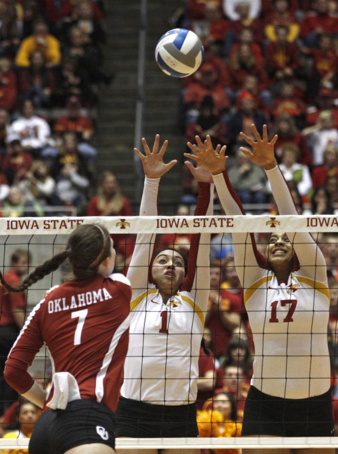 Sophomore setter Jenelle Hudson and senior middle blocker Tenisha Matlock stretch to block the ball during the volleyball game versus Oklahoma at Hilton Coliseum on Nov. 9. The Cyclones won 3-0.