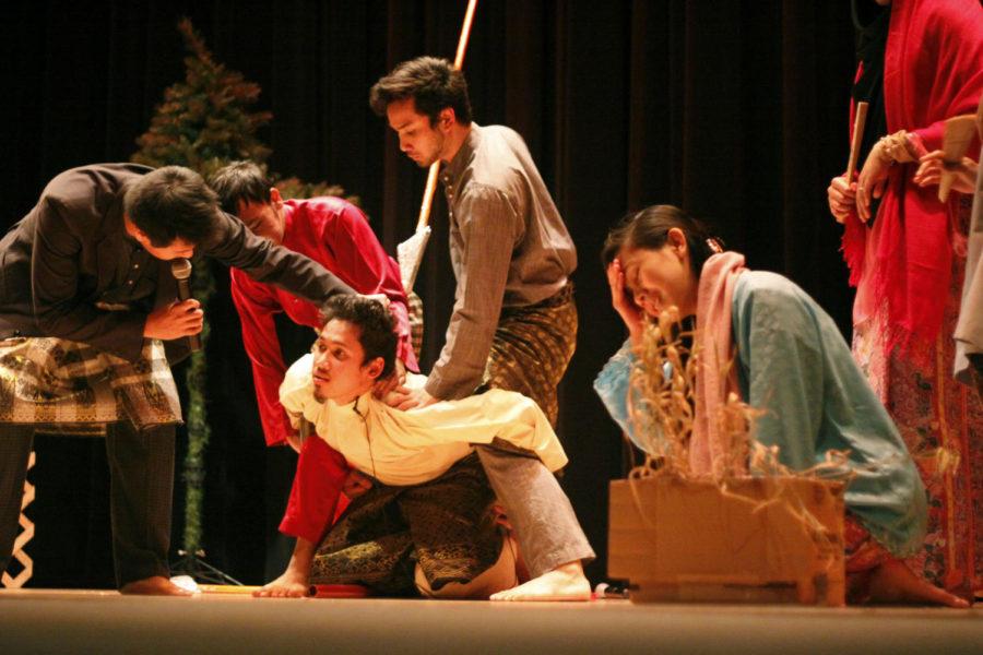 The Association of Malaysian Students at Iowa State presented Mahsuri. At the climax of the play, Mahsuri, loving wife of a husband away at war, is accused by her mother-in-law of committing adultery, an act punishable by death. Above, Mahsuri cries and pleads her innocence while her friend and purported accomplice, Deraman, is questioned. Mahsuri was played by Ezza Melina, senior in psychology, and Aliff Ahmad, senior in mechanical engineering, acted as Deraman.