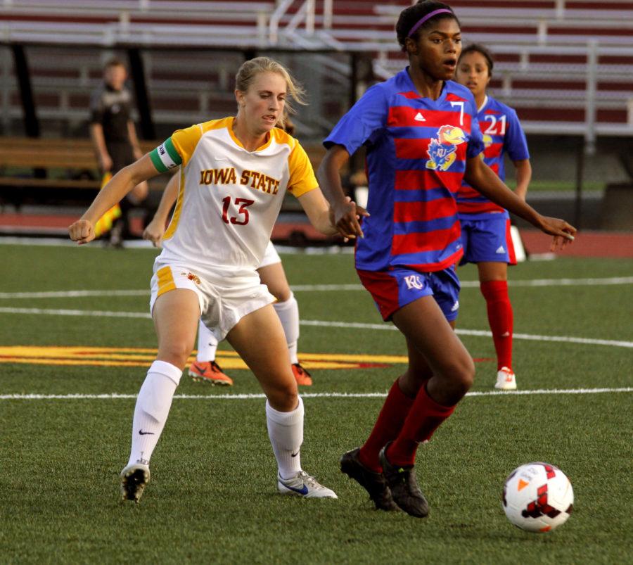 No. 13 senior defender Jessica Reyes fights off a Kansas attacker during Iowa States 0-0 double overtime tie with the Jayhawks on Oct. 4 at the Cyclone Sports Complex.