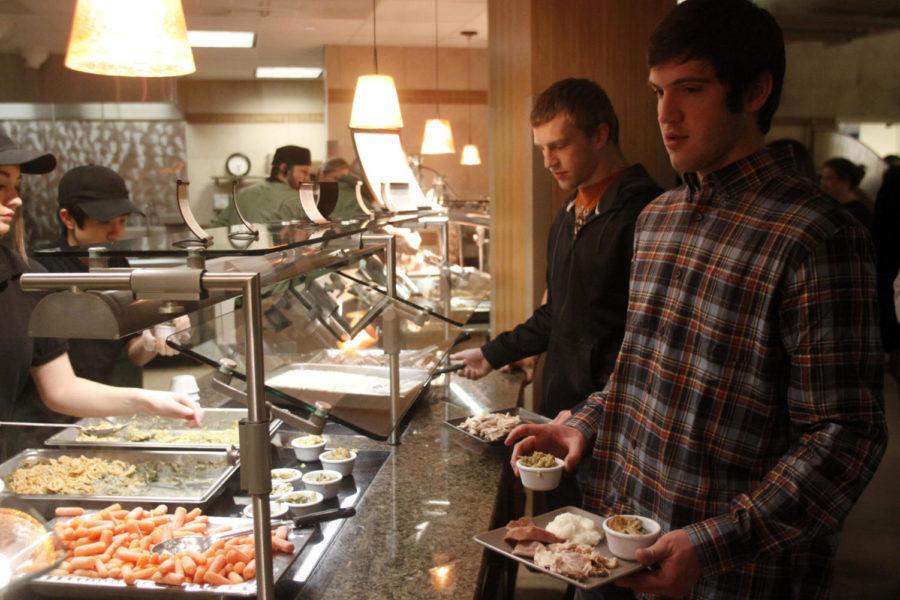 Isaac Glidewell, senior in mathematics, indulges in the Thanksgiving dinner at Seasons on Wednesday, Nov. 20.