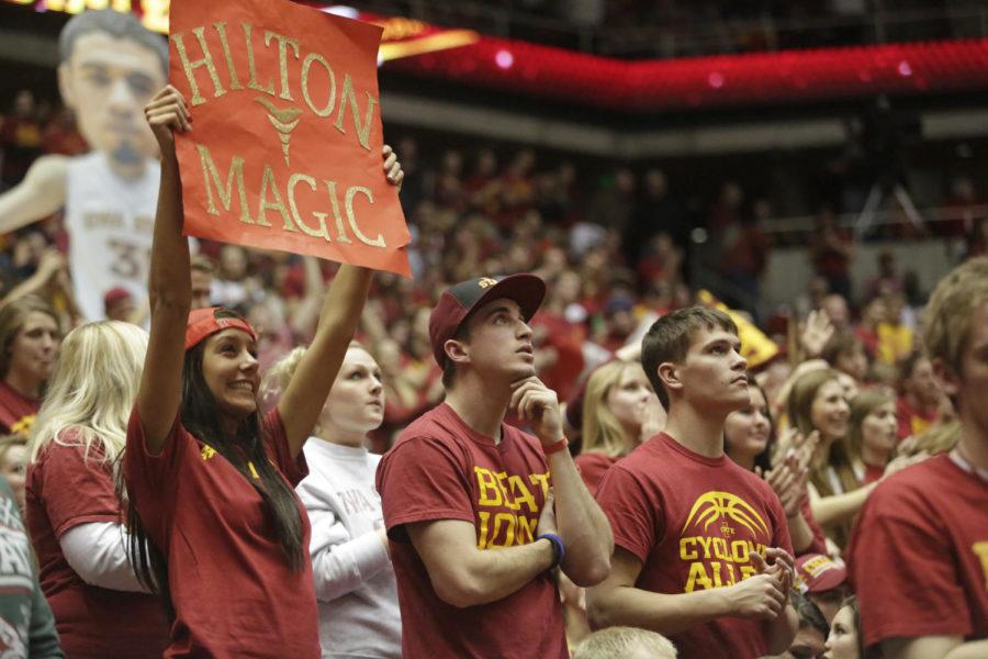 Iowa State fans look up at the video board during Iowa States 85-82 win over Iowa on Dec. 13, 2013, at Hilton Coliseum. 