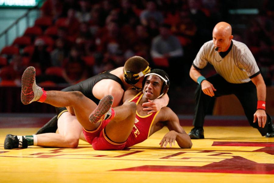 Redshirt freshman Lelund Weatherspoon, 184 pounds, fights to get out of a hold during his match against Ethen Lofthouse, of Iowa, on Dec. 1 at Hilton Coliseum. Weatherspoon would lose to Lofthouse by decision. Iowa State lost the dual to Iowa 23 to 9.