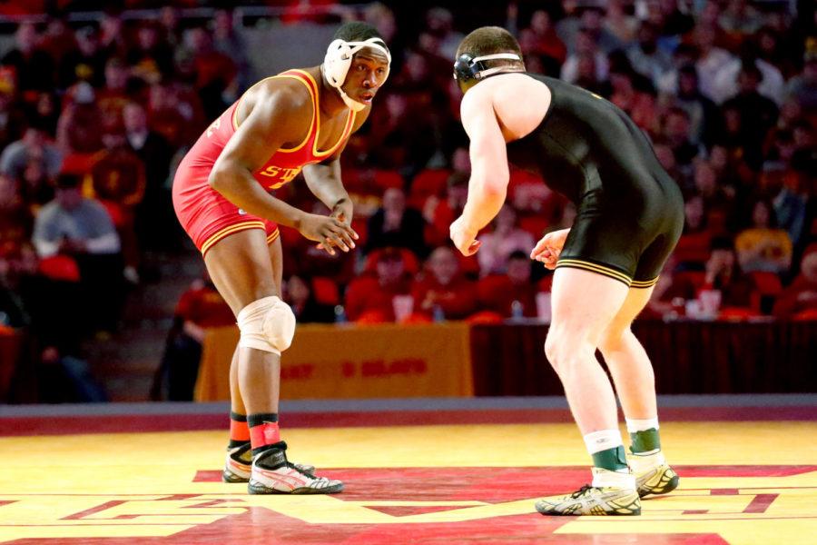 Redshirt junior Kyven Gadson, 197 pounds, circles his opponent Iowas Sam Brooks on Dec. 1 at Hilton Coliseum. Gadson won the match by decision. Iowa State lost the dual to Iowa 23 points to 9.
