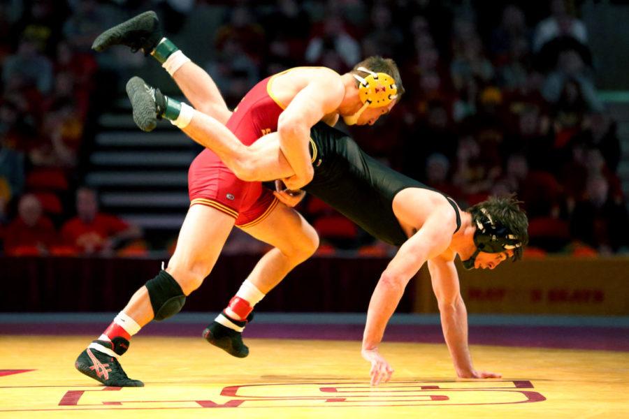 Redshirt+sophomore+Tanner+Weatherman%2C%C2%A0174+pounds%2C%C2%A0attempts+to+lift+his+opponent+Michael+Evans%2C+of+Iowa%2C+during+their+match+on+Dec.+1+at+Hilton+Coliseum.+Weatherman+lost+by+major+decision+to+Evans.%C2%A0Iowa+State+lost+the+dual+to+Iowa+23+to+9.