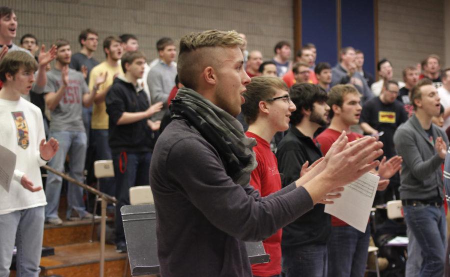 The Iowa Statesmen choir prepares for its Holiday Festival concert, set for Sunday, Dec. 8, 2013.