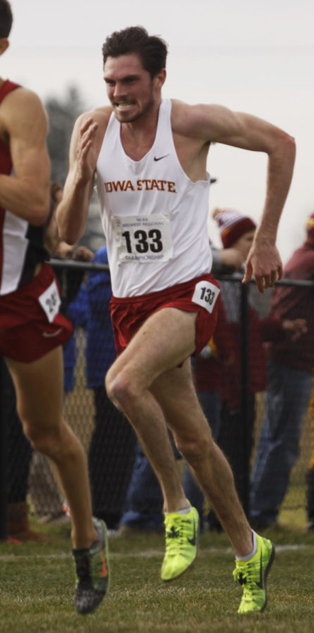 Junior Alexander Dillenbeck sprints ahead to catch the opponent in front of him on Friday, Nov. 15, at the ISU Cross-Country Course during the NCAA Midwest Regional.