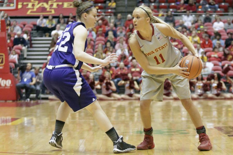 Freshman guard Jadda Buckley looks for a passing lane during Iowa State's 72-50 win over Holy Cross on Dec. 28, 2013, at Hilton Coliseum. Buckley finished with 12 points and two assists.