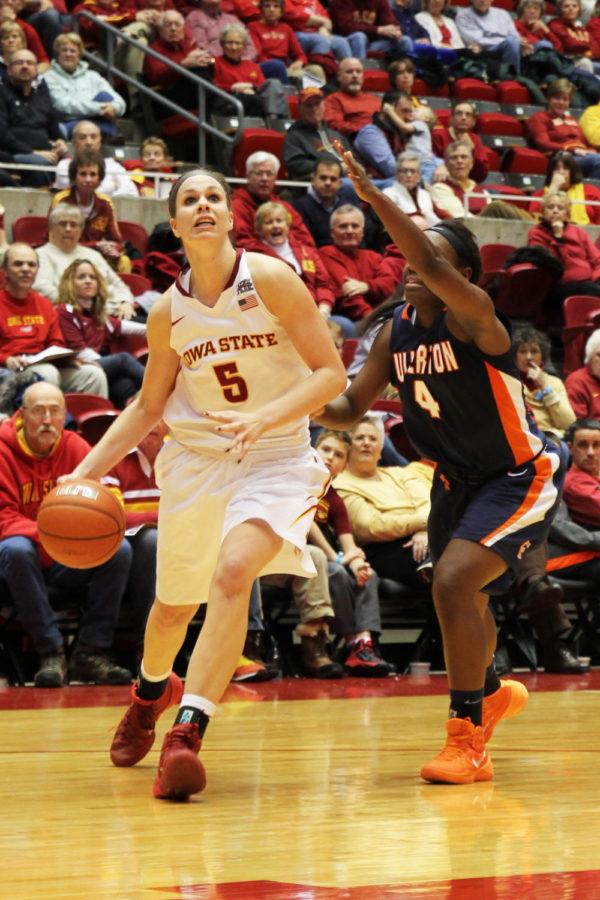 Senior Hallie Christofferosn makes her way to the basket during the game against Cal-State Fullerton on Sunday, Dec. 8 at Hilton Coliseum. Christofferson scored a career-high of 33 points against the Titans.