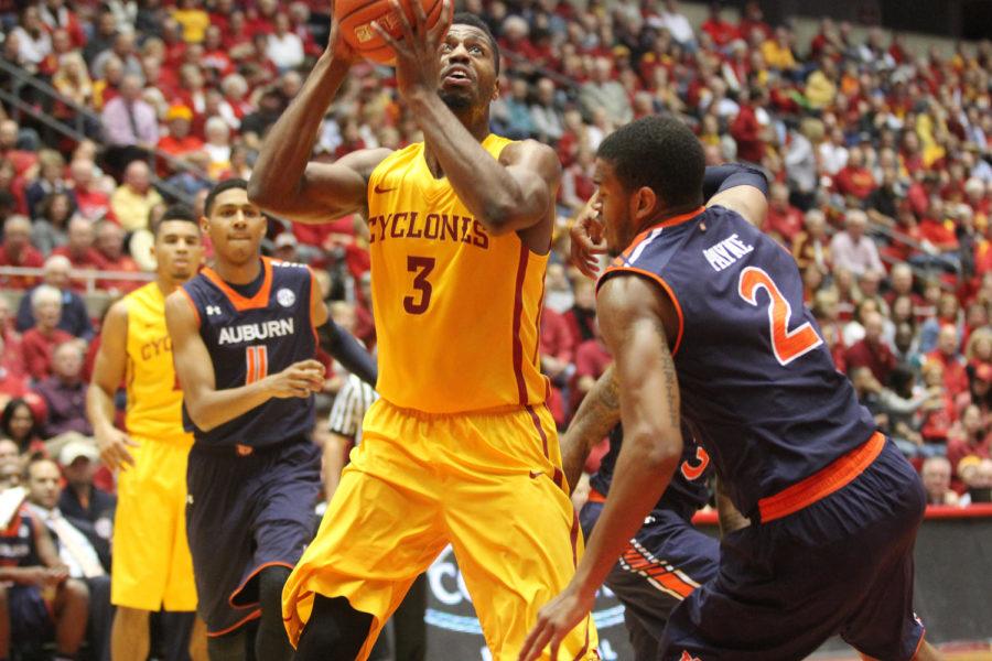 Melvin Ejim pushes past Auburn defense during the home basketball game vs. the Auburn Tigers. The Cyclones lead 47-28 at the half.