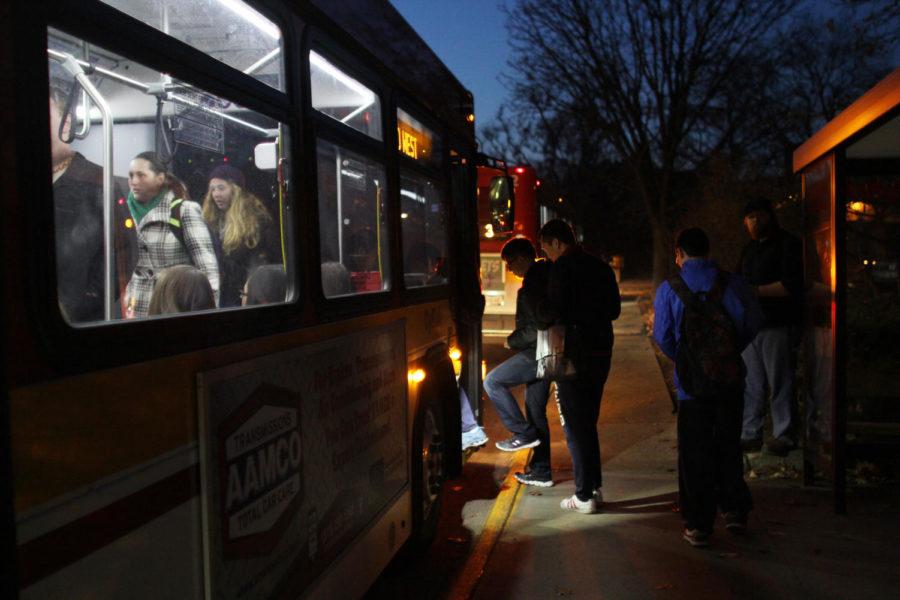 Students board a CyRide bus at the stop in front of Student Services on Monday, Dec. 2. CyRide is looking to add more hours to current routes, as well as adding new routes, in response to the growing ridership and student population.