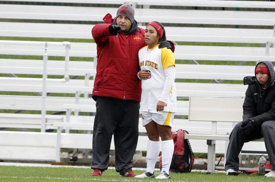 Interim head coach Tony Minatta talks to senior forward Jennifer Dominguez after she was subbed out during Iowa States 1-0 loss to Baylor in the Big 12 Championship tournament game at the Swope Soccer Village on Nov. 6.