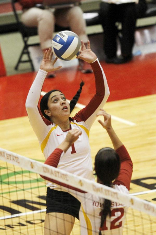 Sophomore setter Jenelle Hudson sets the ball against Texas on Nov. 27, 2013 at Hilton Coliseum. Hudson recorded 40 assists in the 1-3 loss on their final home game of the season.