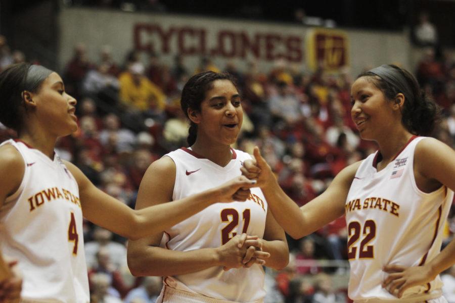 Junior Nikki Moody, senior Tenisha Matlock and junior Brynn Williamson talk on the court at the end of a timeout during the game against Texas Tech on Jan. 8 in Hilton Coliseum.