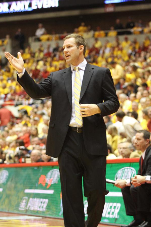 Head coach Fred Hoiberg yells from the sidelines what play to run during the second half of the game against KU. After one overtime, the Cyclones fell to the Wildcats with a final score of 108-96.
