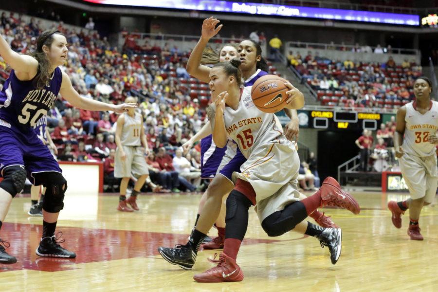 Sophomore guard Nicole Kidd Blaskowsky drives the ball towards the basket during Iowa States 72-50 win over Holy Cross on Dec. 28, 2013, at Hilton Coliseum. Blaskowsky came off the bench to give the Cyclones 11 points and six rebounds.