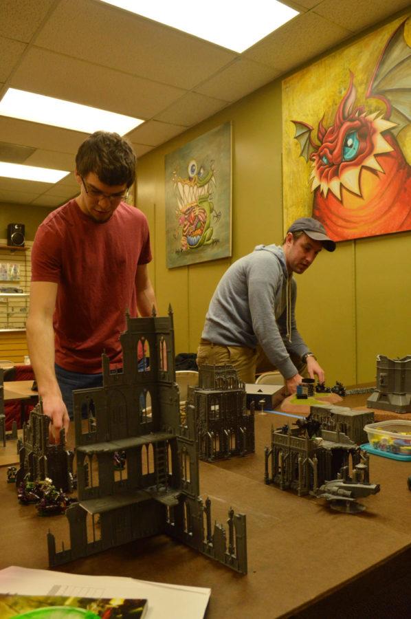 Riley OConnor and Jon Saxton enjoy Warhammer 40k during a tournament put on by Shield Comics in memory of long-time customer Charlie Fisher.