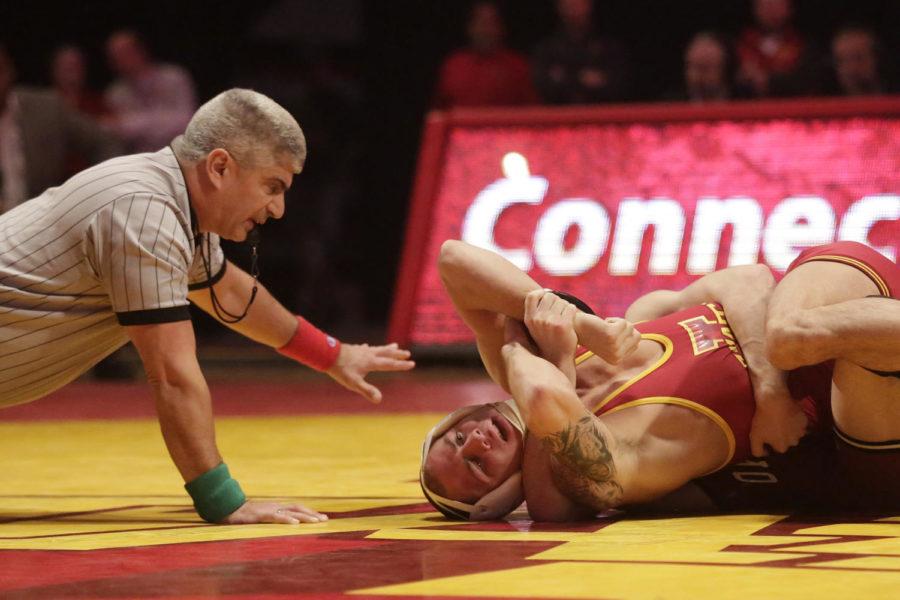 Redshirt freshman Dakota BauerCQ, 133 lbs, tries not to get pinned during Iowa States dual with Oklahoma on Jan. 12 at Hilton Coliseum. Bauer lost by tech fall. Iowa State lost the dual to Oklahoma 11 to 27.