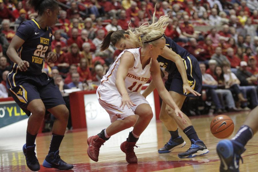 Freshman guard Jadda Buckley goes for a loose ball against West Virginia on Jan. 15 at Hilton Coliseum. The Cyclones fell to the Mountaineers 73-59. Buckley had 15 points and six rebounds.