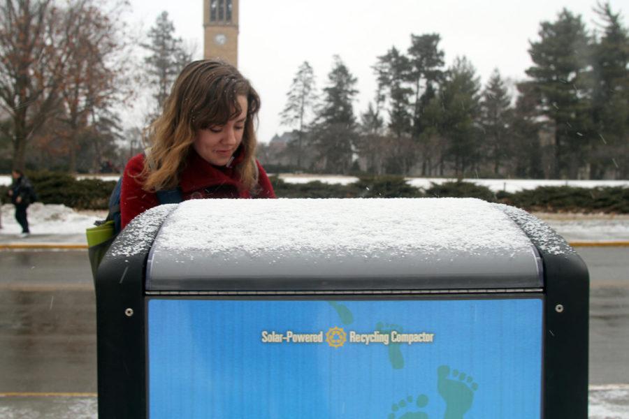 Krista Johnson, senior in political science, utilizes the recycling compactors on campus, as well as the trash compactors available through out the university grounds.