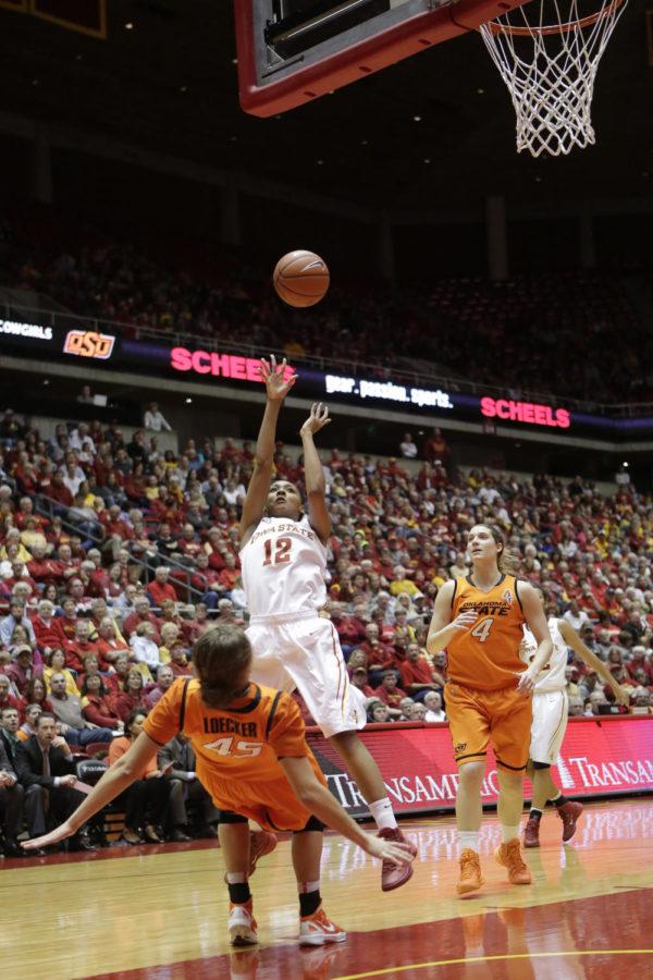 Freshman guard Seanna Johnson attempts a jump shot in the paint during no. 11 Iowa States 69-62 loss to no. 15 Oklahoma State on Jan. 11 at Hilton Coliseum. Johnson had her third double-double of the season with 14 points and 10 rebounds.