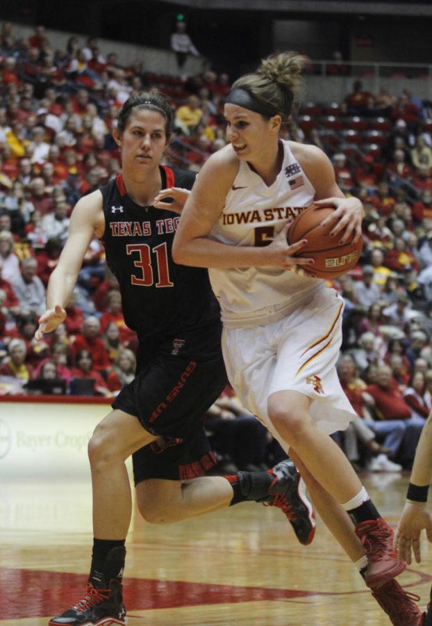 Senior forward Hallie Christofferson works to get past a Texas Tech player during the game on Jan. 8 in Hilton Coliseum. Christofferson had 22 points for the Cyclones 74-48 win over the Red Raiders.