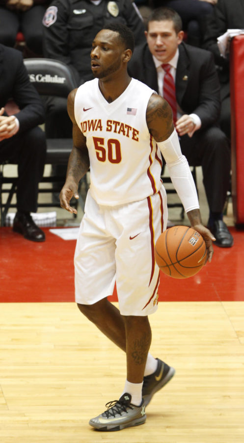Senior guard DeAndre Kane looks to pass to a teammate during the game against Northern Illinois on Dec. 31, 2013. The Cyclones won 99-63.